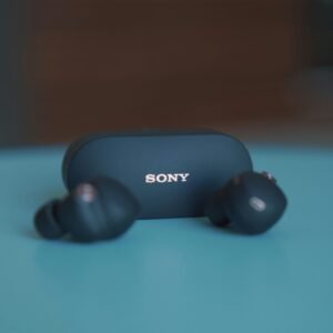 black sony headphones on blue table